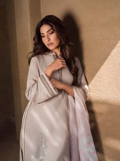 Brand: SaharProduct Code: S24-TL-L1-05Collection: Mirage by Sahar Unstitched Spring Summer CollectionFabric: Lawn DESIGN DETAILS: Embroidered Front Panel on Fancy Slub Lawn Fancy Slub Lawn Back Panel Embroidered Sleeves Digital Printed Silk Dupatta 2.5M Dyed Cambric Trouser 2 M DISCLAIMER:* Lining, Laces, and Tassels are not included in unstitched variants.* Embellishment items in stitched outfits are subject to market availability.* Product color may vary due to photographic lighting or your device settings. CARE INSTRUCTIONS: Extra Fabric Has Been Used For Shoot Original Color May Vary Slightly From The Picture Dry Clean Recommended Iron The Clothes At Moderate Temperature Do Not Use Bleach, Or Stain Removing Chemicals Damp Fabric Should Not Be Exposed To Sunlight Mirage by Sahar Unstitc Lawn Design, Embroidered Sleeves, Luxury Wear, Silk Dupatta, Fabric Stores Online, Printed Silk, Designer Suits, Photographic Lighting, Pakistani Fashion