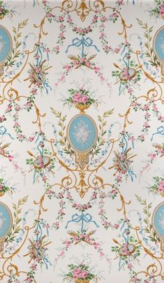 an ornate wallpaper with blue and pink flowers