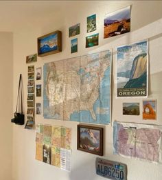 a wall filled with lots of pictures and maps