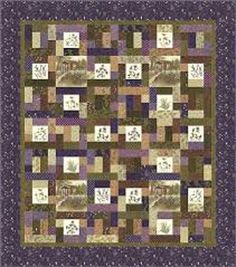 a quilt made with squares and numbers on the front, in shades of brown, purple, and green