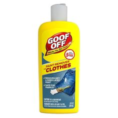 a bottle of goo off paint remover and cloths on a white background,