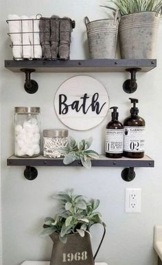 a bathroom with two shelves above the toilet and a potted plant next to it