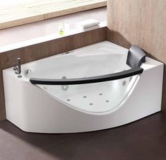 a white bath tub sitting next to a window