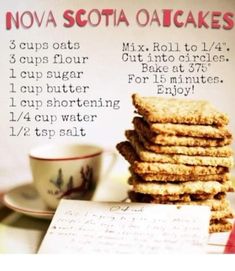 a stack of crackers sitting next to a cup and saucer