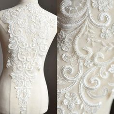 the back of a wedding dress with white lace on it and an image of a mannequin's torso