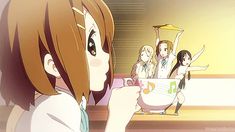 an anime character holding a cup in her hand and pointing to the side with other characters behind her