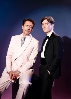 two men in tuxedos posing for the camera