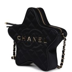 This Chanel quilted CC star bag is in black satin fabric with light gold hardware and features an exterior back slip pocket, dual zip top closure and an interwoven light gold chain link and black satin leather shoulder strap.The interior is lined in black grossgrain canvas and black leather with two open slip pockets on each wall.Collection: 24C (RFID)Origin: FranceCondition: New and never worn Accompanied by: Chanel box, Chanel dustbag, retail UPC, RFIDMeasurements: 8.5" width x 7.25" height x 2" depth; 19" strap drop Chanel 2024, Star Bag, Black Satin Fabric, Chanel Box, Chanel Store, Chanel Cruise, Couture Mode, Madison Avenue, Party Style