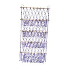 a purple and white wall hanging rack with many strings on it's sides,