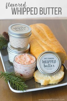 bread, jams and whipped butter on a tray with pine cones in the background