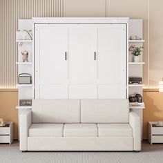 a white couch sitting in front of a book shelf