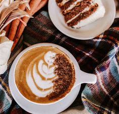 two white plates topped with desserts on top of a plaid table cloth next to carrots