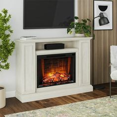 a living room with a fireplace and tv mounted on the wall next to a chair