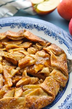 an apple pie on a blue and white plate