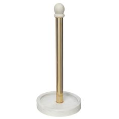 a white and gold toilet brush holder on a marble base with a brass - plated handle