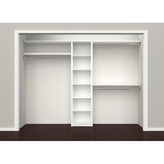 an empty white closet with shelves on the wall