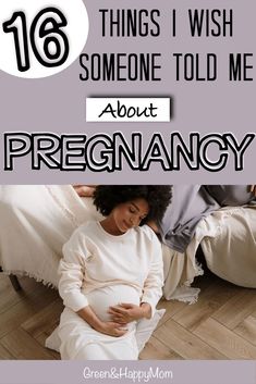 a pregnant woman is sitting on the floor with her belly in her hands and text that reads