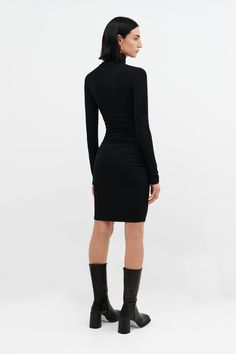 Who doesn't need a versatile turtleneck dress? Meet Phoebe. She sets the tone for any occasion. Her soft, high-stretch and sustainable European jersey gracefully hugs your figure while her mid-waist ruching detail provides a stylish slimming effect. Wear Phoebe for work, weekend, whatever — just switch out your shoes and accessories to match the mood.[SPLIT] Emily, in black, is 5'9.5" (177 cm) tall, wearing size XS. Maritza, in black, is 5'9.5" (177 cm) tall, wearing size XS. Astrid, in slate gr Oversized Tunic Dress, Black Turtleneck Dress, Turtleneck Dress, Grey Turtleneck, Oversized Tunic, Black Turtleneck, Turtle Neck Dress, Grey Women, Winter Looks