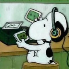 a cartoon dog with headphones on sitting at a desk and holding a tablet computer