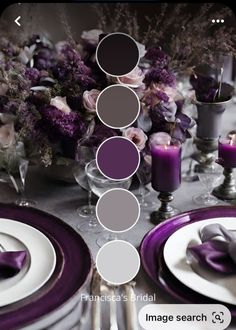 the table is set with purple and white plates, silverware, and flower centerpieces