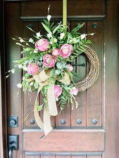 a wreath is hanging on the front door