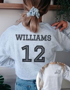 the back of a woman's sweatshirt that says, williams 12 and has an image of