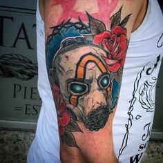 a man with a gas mask tattoo on his arm