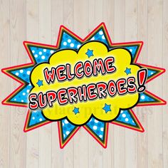 the welcome superheros sign is displayed on a wooden background with blue and yellow stars