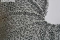 close up view of the crochet pattern on a sweater