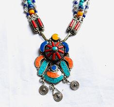 Handmade vintage Tibetan Necklace with Mix Stones and Brass Pendants. Art Deco style Necklace Handcrafted by Nepali Artist in Kathmandu Nepal. Turquoise,Coral , Lapis, Amber mix Metal etc Heavy Multicolor Metal Necklaces, Heavy Multicolor Metal Necklace, Blue Vintage Necklace For Festival, Bohemian Heavy Multicolor Necklaces, Heavy Bohemian Multicolor Necklaces, Bohemian Multicolor Necklaces, Vintage Multicolor Necklaces For Festivals, Vintage Metal Necklace With Colorful Beads, Vintage Metal Necklaces With Colorful Beads