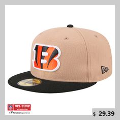 a new era hat with the nfl logo on it, featuring an orange and black stripe