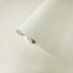 a close up view of a plain white fabric with a small hole in the middle