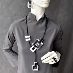 "Qubo geometric slider necklace, Contemporary necklace, Artistic adjustable necklace, Black and white necklace, Mix media necklace, Handmade... Contemporary designed long necklace. Perfect for minimalist style and artistic casual look. This beautiful multi design concept necklace is adjustable in size and hypoallergenic. Necklace is on leather cord and by sliding elements you can change length, position and design. Dimensions: Necklace: length of leather cord is 31.5\"/ 80cm. Earrings: Length: 1 Chic White Handmade Necklace, Modern Adjustable Lariat Necklace, Elegant Geometric White Jewelry, Elegant White Geometric Jewelry, Modern White Pendant Jewelry, Unique White Adjustable Necklace, Minimalist White Jewelry With Adjustable Length, Artistic White Adjustable Jewelry, White Long Chain Necklace