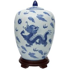 a blue and white vase with a dragon on it