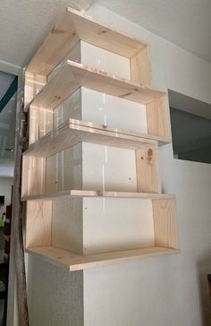 the shelves are made out of plywood and have glass inserts on each shelf