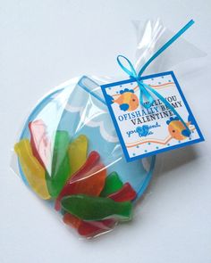 gummy bears wrapped in cellophane and tied with a blue ribbon