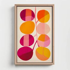 an abstract painting on a white wall with pink, orange and yellow circles