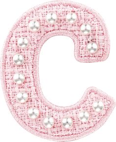 the letter c with pearls is shown in pink and white fabric on a white background