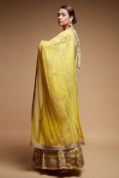 Mustard attached cancan lehenga with all over floral blossom prints. Paired with a cape sleeve, padded blouse with all over floral print and dupatta with floral prints. - Aza Fashions Yellow Chikankari Embroidered Dupatta For Reception, Yellow Chikankari Embroidered Sharara For Reception, Yellow Chikankari Embroidery Dupatta For Reception, Yellow Chikankari Embroidery Sharara For Reception, Yellow Anarkali Set With Chikankari Embroidery For Reception, Yellow Chikankari Embroidered Floor-length Lehenga, Floor-length Chanderi Dupatta With Floral Embroidery, Festive Floral Print Pre-draped Wedding Saree, Festive Floral Pre-draped Saree For Wedding