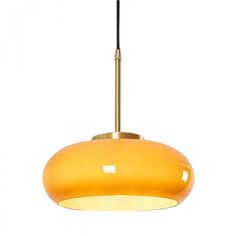 an orange light hanging from a ceiling fixture