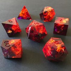 several red dices sitting on top of a table