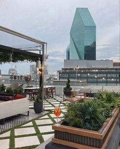 an outdoor seating area on the roof of a building