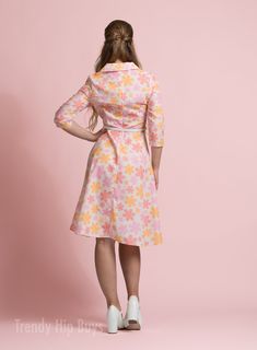 • Embrace timeless elegance with our Vintage Style Dress, evoking the charm of 50s and 60s Dress Style.• This Vintage Inspired Dress features a Pastel Orange, Pink Floral pattern, perfect for adding a touch of vintage flair to your wardrobe.• Crafted from a cotton-like polyester blend, this A-line Dress offers both comfort and style, ideal for all-day wear.• With a wing collar neckline and 3/4 sleeves, this Vintage Shirt Dress Style exudes sophistication, while the knee-length A-line skirt adds Retro A-line Vintage Dress For Garden Party, Retro A-line Midi Dress For Garden Party, Retro Fit And Flare Knee-length Dress, Retro Fit And Flare Midi Dress, Retro Mid-length Fitted Dress, Retro Dresses For Spring Retro-themed Events, Vintage Dress For Retro-themed Spring Events, Spring Vintage Dress For Retro-themed Events, Retro Fit And Flare Tea-length Dresses