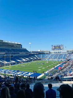 an empty football stadium filled with people