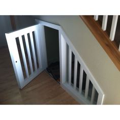 an open door in the corner of a staircase