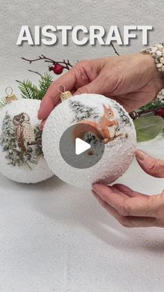 two handmade christmas baubles are being held by someone's hands, with the words alstcraff above them