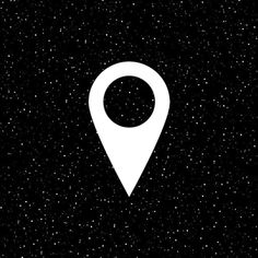 a white pin on a black background with stars in the night sky and space around it