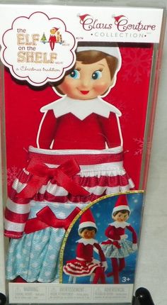 the elf in the shelf is wearing a red and white dress with matching headbands