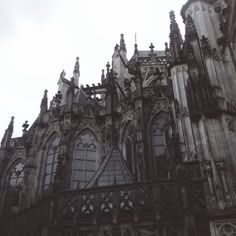 an old building with many windows and clocks on it