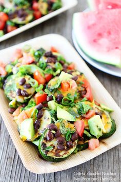 this is a salad with black beans, avocado and watermelon on the side